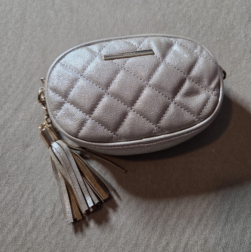 Aldo Quilted Metallic Silver Oval Crossbody with Tassel